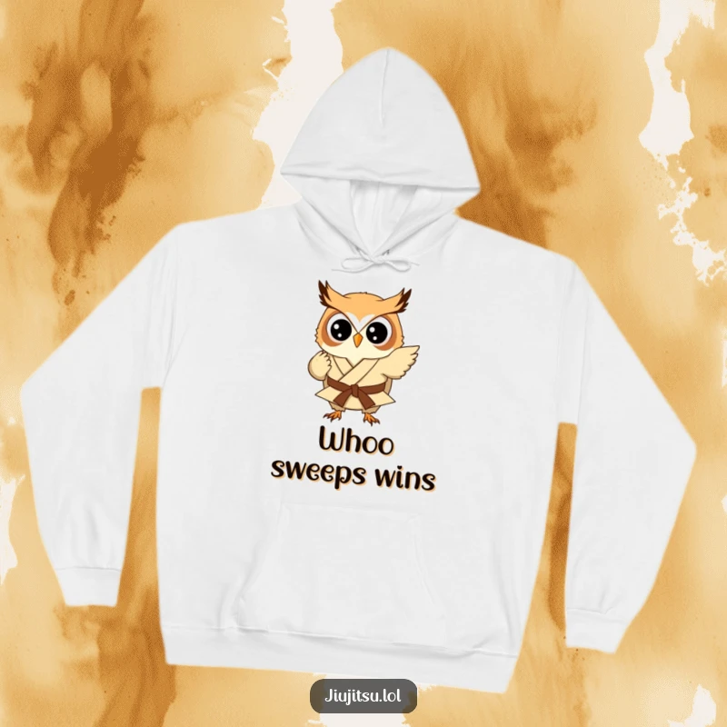 Funny Owl Judo Sweep Hoodie: A round owl in a tiny judo gi is depicted mid-sweep, offering warmth and a funny, determined vibe.